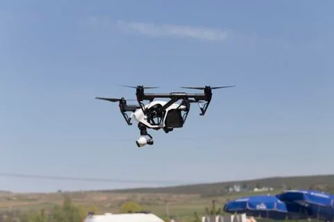 Flying quadcopter drone. Stock Photos