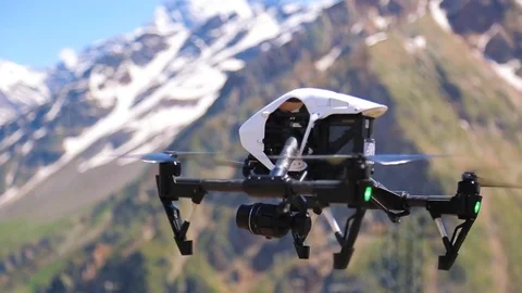 Flying quadcopter in the mountains Stock Footage 79271367