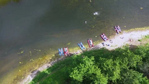 Flying quadcopter over catamarans on the clean beautiful river Stock Footage 246581048