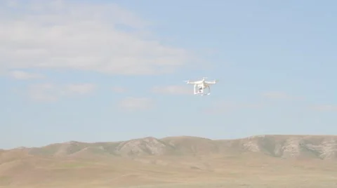 Flying quadrocopter drone in the sky Stock Footage 62978711