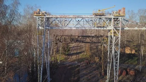 Flying a quadrocopter over a large railway crane. Industrial structure. Stock Footage 108961937