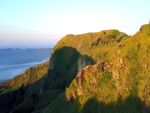 Flying on a quadrocopter over a smoking volcano, an amazing sight Video stock 82969367