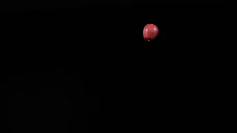 Flying red apple, close up at ripe apple flies up and spinning in slow motion Stock Footage 152789473