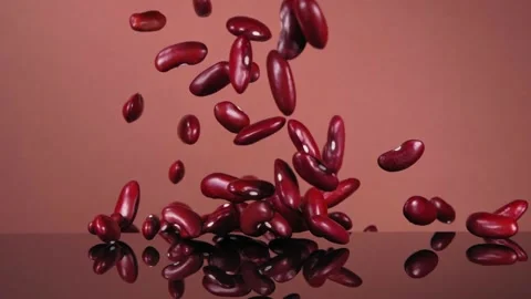 Flying red beans on a brown background. Red beans. Super slow motion. Stock Footage 150066147