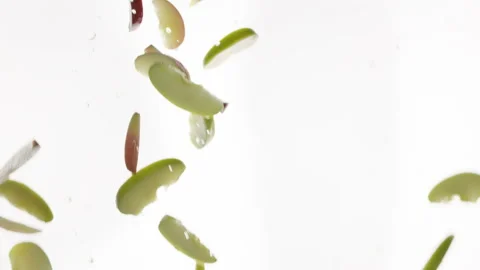 Flying of Red, Green Apple and Slices in white Background Stock Footage 147342096