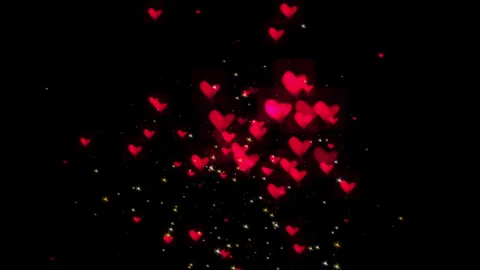 Flying red hearts among multi-colored shooting stars Video stock 285602675