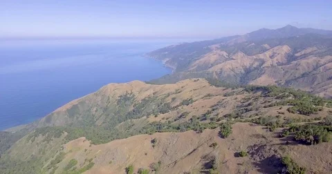 Flying in reverse above Big Sur, California Stock Footage 76330581