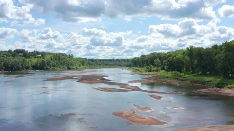 Flying on a river in a shallow part on a sunny day. Stock Footage 119072907