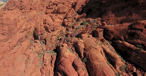 Flying by a rock wall in Red Rock Canyon, Nevada Stock Footage 73528707