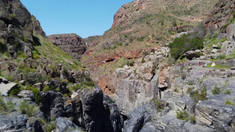 Flying into a rocky deep canyon Stock Footage 183567016