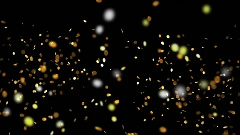 Flying round spangles of gold on a black background HD 1920x1080 Stock Footage 124712513