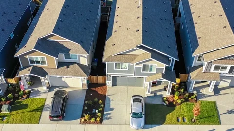 Flying by a row of new construction homes for sale Stock Footage 96348128