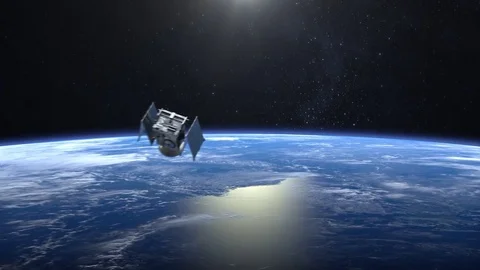 Flying satellite. The solar panel opens. The satellite appears in the frame and Video stock 85439829
