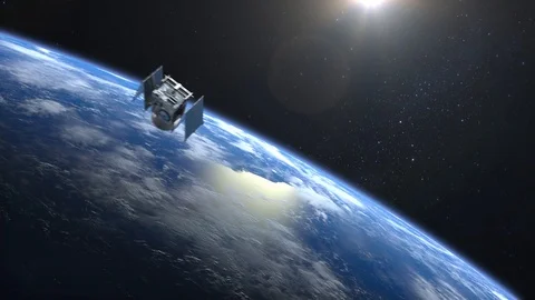 Flying satellite. The solar panel opens. The satellite appears in the frame and Stock Footage 86029669