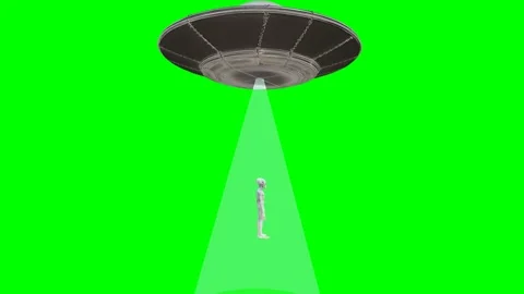 Flying saucer UFO performing alien abduction with tractor beam 4K Stock Footage 336916440
