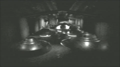 Flying Saucers Discs UFOs in Hangar old film Stock Footage 194862476