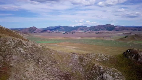 Flying in a semicircle over the mountains, part 1 Stock Footage 166486642