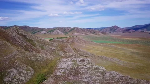 Flying in a semicircle over the mountains, part 2 Stock Footage 166487084
