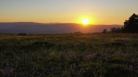 Flying into  Setting sun on top of the mountin Stock Footage 104903904