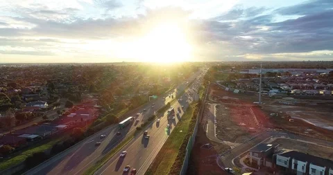 A flying shot that features a stretch of motorway busy with all sorts of Stock Footage 114015752