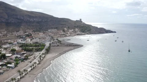 Flying shot looking over the stony beach from La Azohia in Spain Video stock 164240890