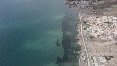 Flying shot looking over the stony beach from La Azohia in Spain Video stock 164240973