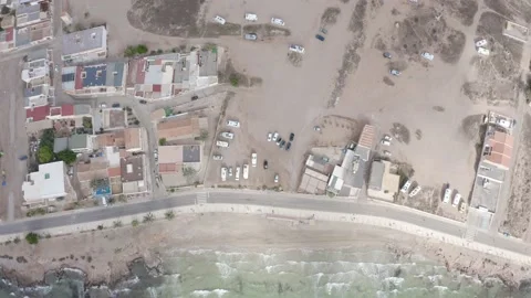 Flying shot looking over the stony beach from La Azohia in Spain Video stock 164240976