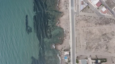 Flying shot looking over the stony beach from La Azohia in Spain Video stock 164241065