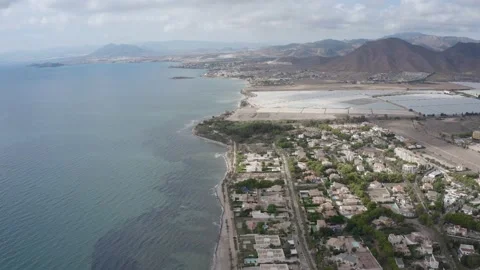 Flying shot looking over the stony beach from La Azohia in Spain Video stock 164241131