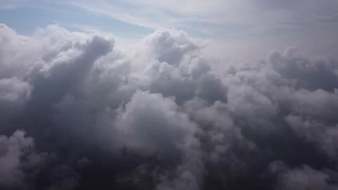 Flying sidewards right in the middle of and above of the Clouds, Aerial View. Stock-Footage 139315352
