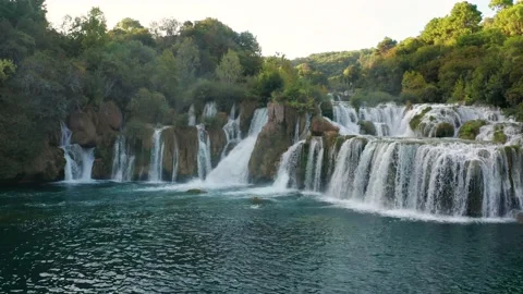 Flying sideways slowly by the beautiful Krka Waterfalls in Krka National Park Stock Footage 220172434