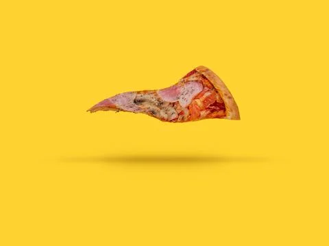 A flying slice of pizza on a yellow background Stock Photos