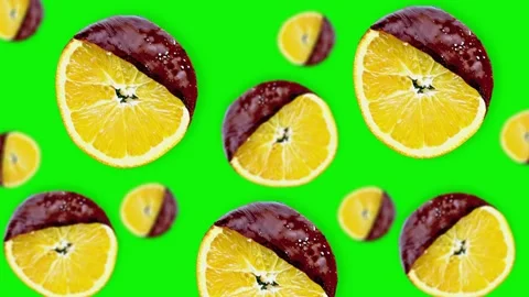 Flying  slices of orange of different diameters on green screen isolated Stock Footage 163438298
