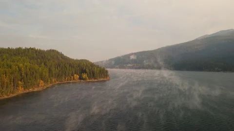 Flying slow forward over lake misty morning - 4k drone aerial Stock Footage 234095790