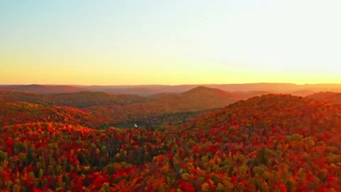 Flying slowly from right to left above the mountains at sunset Stock-Footage 164009846
