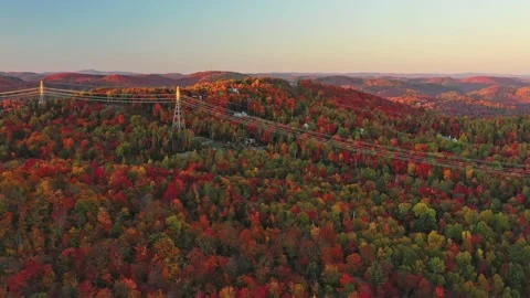 Flying slowly from right to left above the mountains at sunset Video stock 164010002