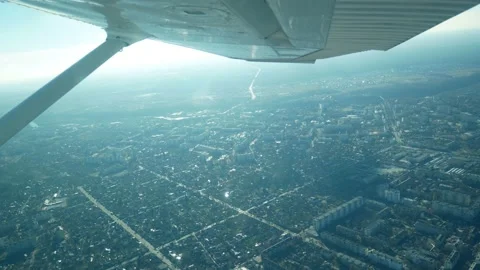 Flying in a small light plane. Aerial view from the window of a small aircraft Stock Footage 169857865