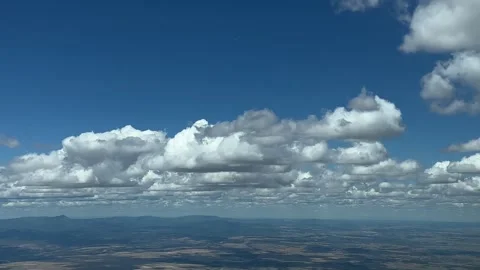Flying smoothly across a typical summer sky with some tiny cumulus clods. Stock Footage 245345779