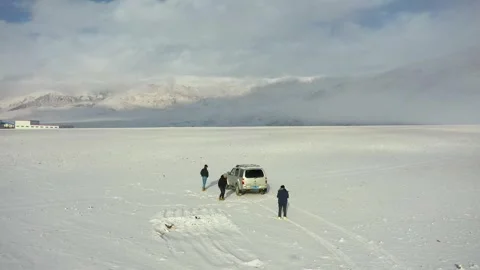 Flying to the snow to fly the drone Stock Footage 243044966