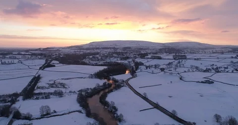 Flying in the snowy valley Stock Footage 104803469