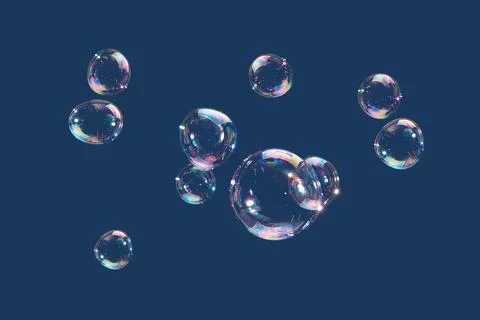 Flying soap bubbles isolated on blue background. Abstract background. Stock Photos