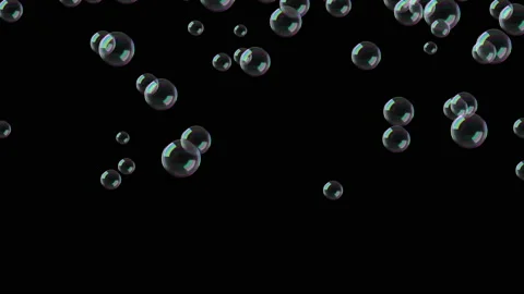 Flying soap bubbles. A lot of soap bubbles fly across the screen. Video stock 229981244