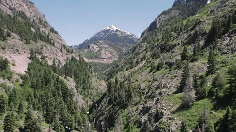 Flying from South through Mountain Pass near Ouray Colorado 4K Stock Footage 244675900