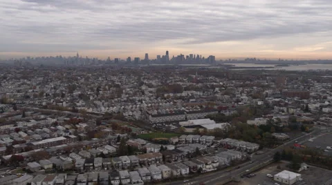 Flying southeast over Bayonne, New Jersey, with Manhattan skyline in background. Stock Footage 59163562