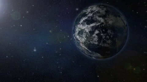 Flying by spinning planet Earth in starry solar system Stock Footage 73972915
