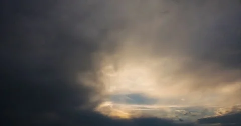 Flying storm clouds at sunset Stock Footage 80018699