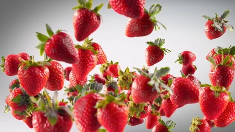 Flying of Strawberry in Dark Grey Background Stock Footage 129403677