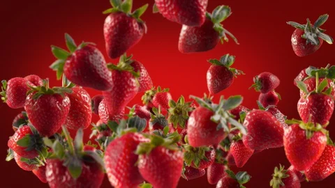 Flying of Strawberry in Deep Red Background Stock Footage 129405092
