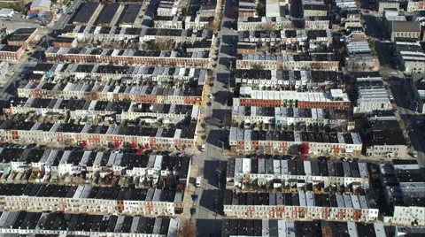 Flying up a street between blocks of row houses in Baltimore, Maryland. Shot in Stock Footage 59214086