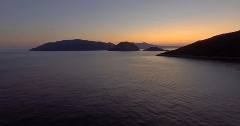 Flying in the sunset above the sea Stock Footage